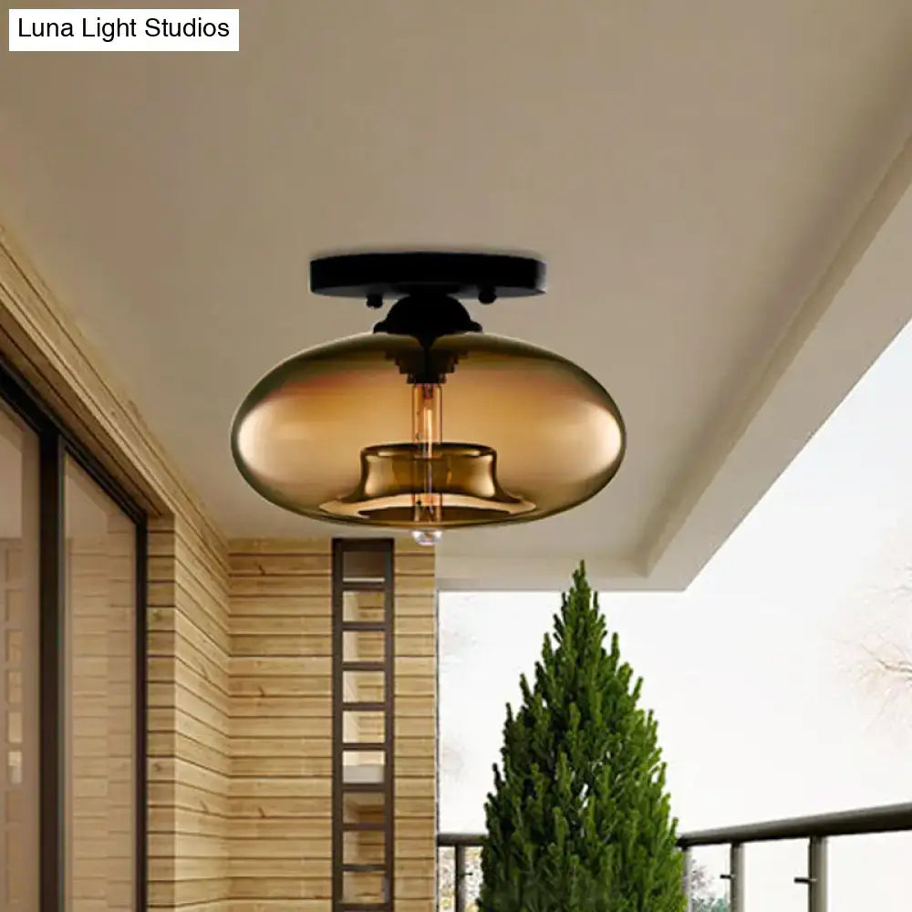 Decorbites™ amber-tinted glass oval flush mount pendant light with black metal ceiling mount and exposed filament bulb