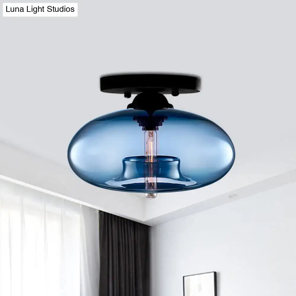 Blue glass oval flush mount pendant light with black metal ceiling mount for hallway by DecorBites