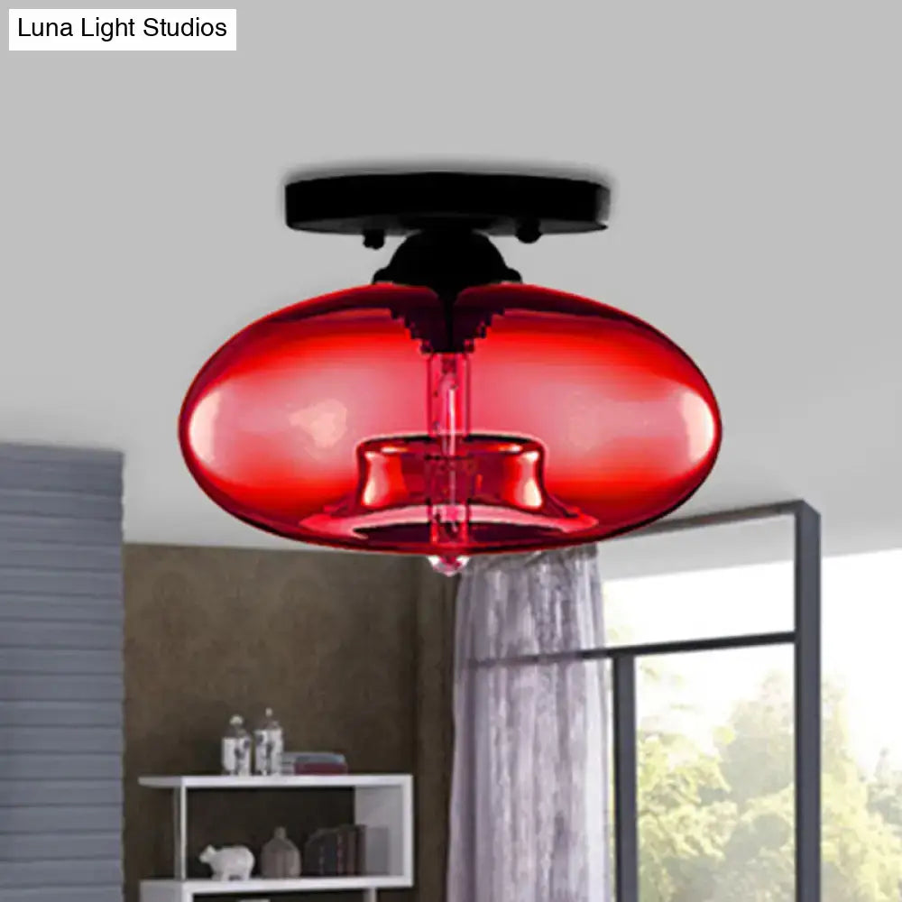 Vibrant red glass oval flush mount pendant light with sleek black base from decorbites simple style collection