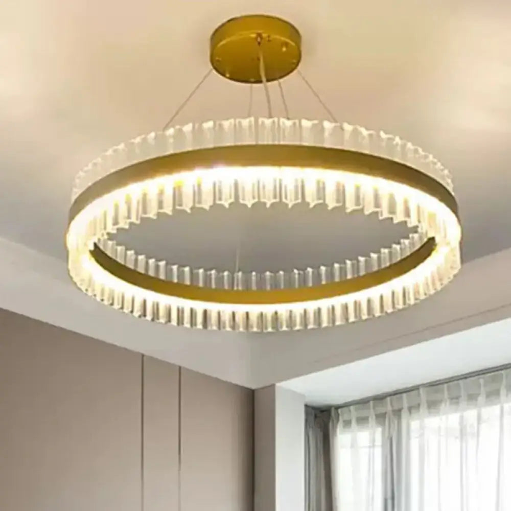 Gold-toned decorbites™ simplicity crystal pendant light with faceted rings and integrated led for living room use