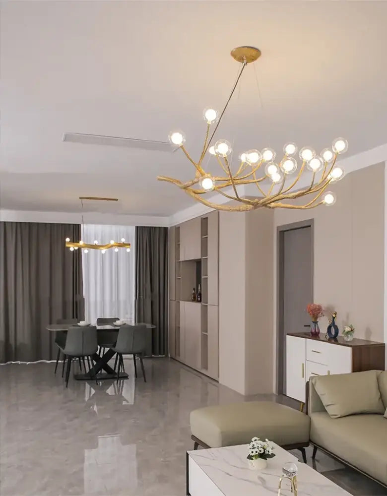 Gold-toned decorbites simulation iron tree branch bubble chandelier with multiple spherical bulbs and branching design