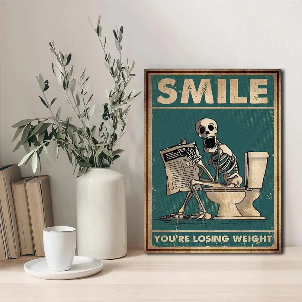 DecorBites™ skeleton man squatting toilet canvas wall art featuring a vintage-style skeleton man reading newspaper teal background