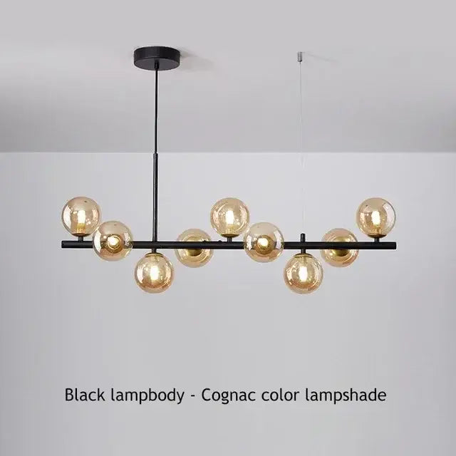DecorBites sleek glass ball chandelier in black metal with amber-tinted glass globes for dining room lighting