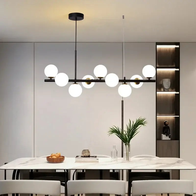 Modern black metal decorbites sleek glass ball chandelier with spherical white glass globe lights for dining room