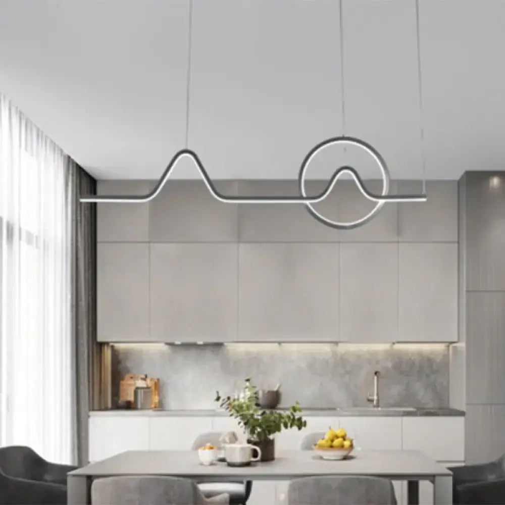 DecorBites™ sleek island light fixture with silver metallic finish and abstract wave design for modern living rooms