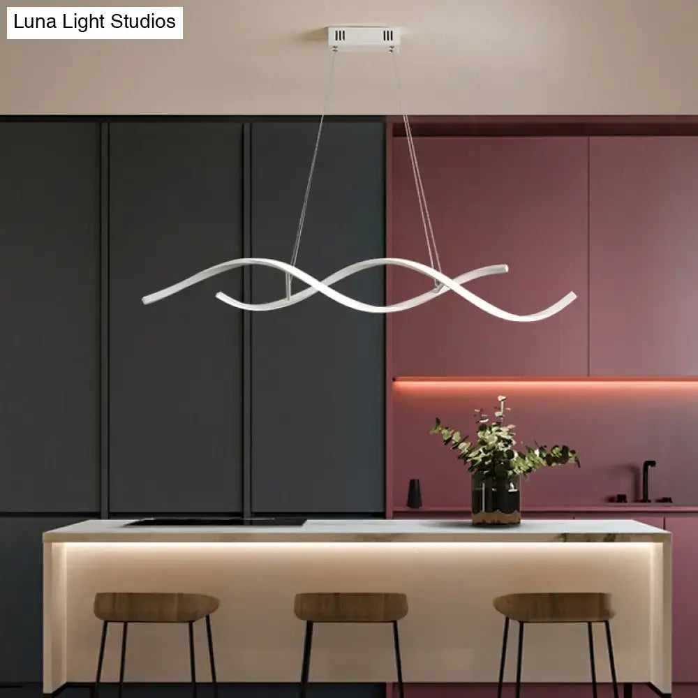 A sleek white LED pendant light with a modern wave design in aluminium simplicity island style for dining rooms