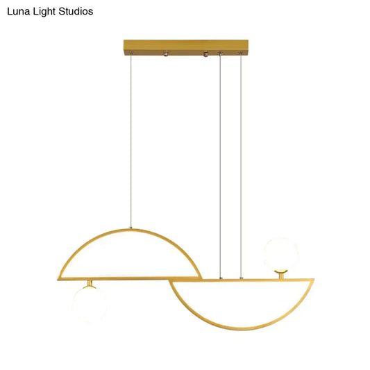 Modern gold-toned ceiling light with sleek semi-circular metal frames and frosted glass globe accents for dining room island light fixture