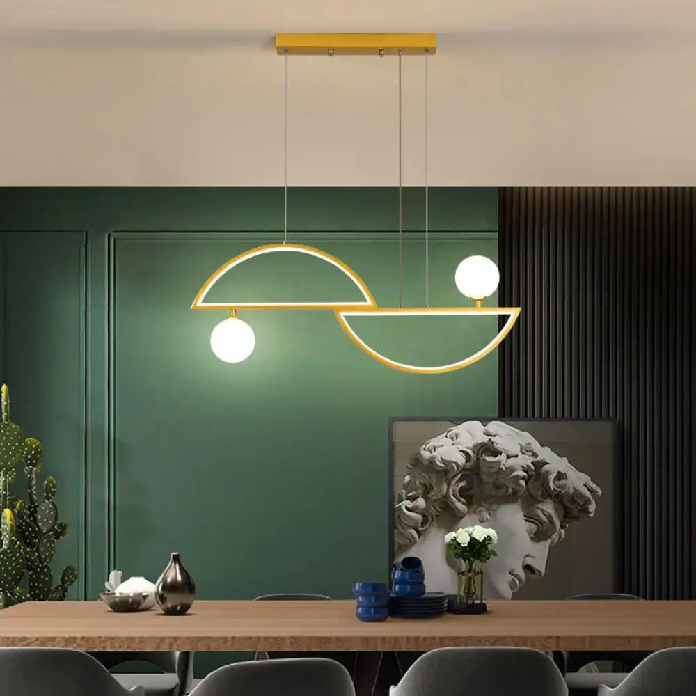 Modern gold-toned DecorBites™ semi-circle island light fixture with sleek geometric design and white opal glass ceiling light