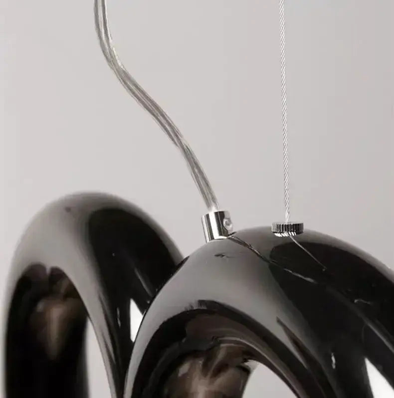 Black glossy resin modern u-shaped chandelier with curved ring design and metallic hardware for bedroom and kitchen