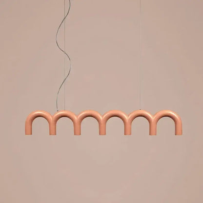 A modern peach-colored DecorBites™ sleek u-shaped chandelier with curved arches for bedroom and kitchen lighting