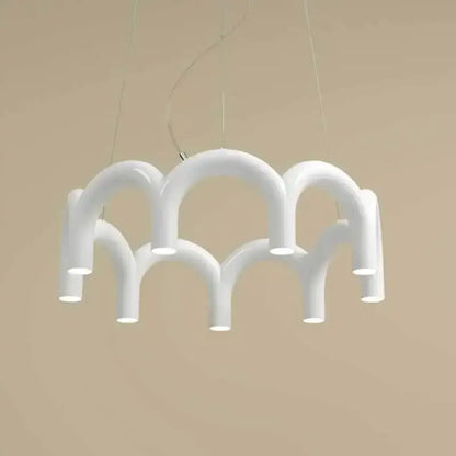 White modern u-shaped chandelier by DecorBites with sculptural interconnected tubes for bedroom and kitchen lighting