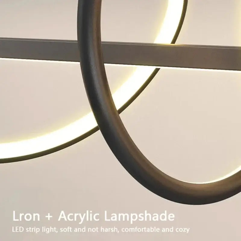 DecorBites sleek wavy pendant lights with black iron and acrylic shade featuring warm led strip lighting for dining room