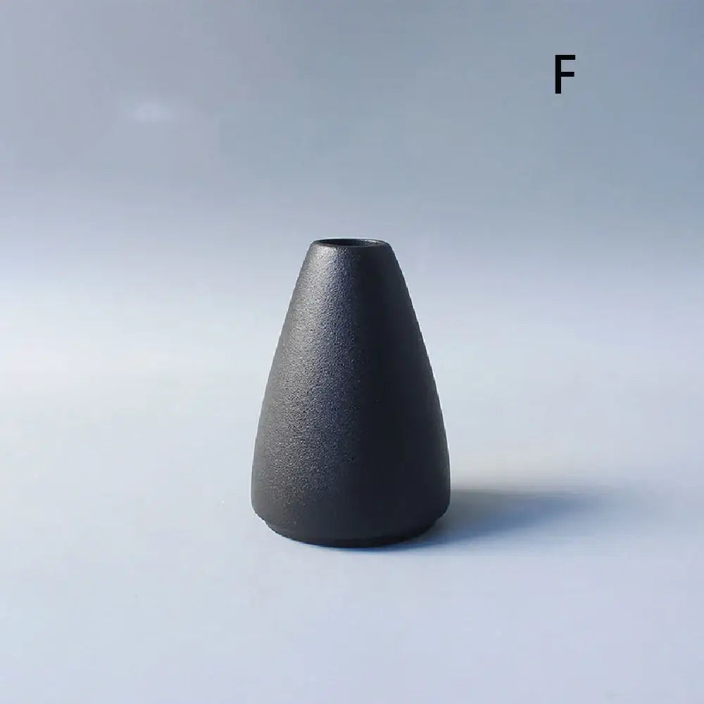 Matte black ceramic small vase with tapered conical shape and textured surface for elegant japanese home decor