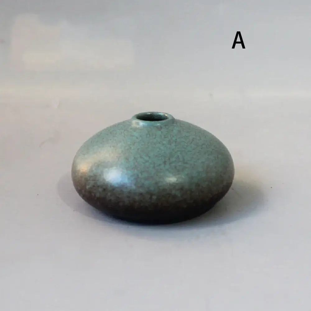 Decorbites small ceramic vase with speckled teal glaze and darkened base for elegant japanese home decor