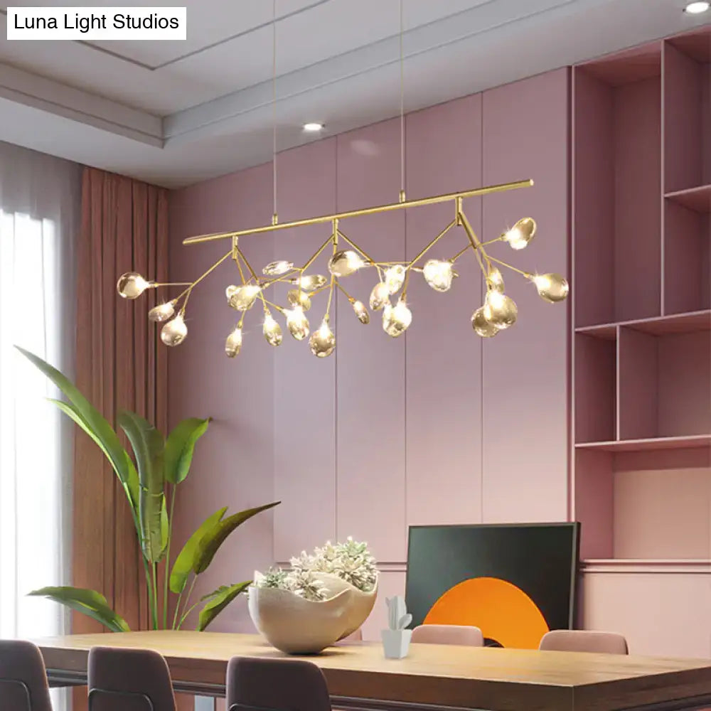 Gold-toned branch-style pendant light with clear teardrop-shaped globes for decorbites smoke grey glass firefly island lighting