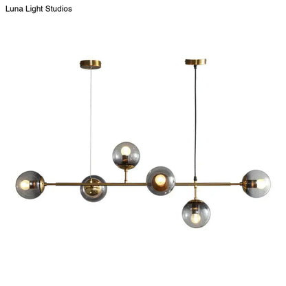 Decorbites™ smoke grey glass island pendant light with six smoke grey globes and brass finish ideal for restaurants