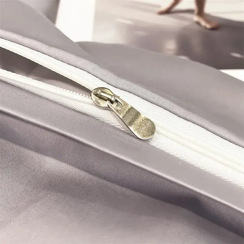 Silver-toned zipper with metallic pull tab on gray smooth fabric of decorbites soft egyptian cotton duvet cover piece