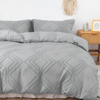 Gray quilted duvet cover set with geometric embroidery pattern made from soft tufted microfiber by DecorBites