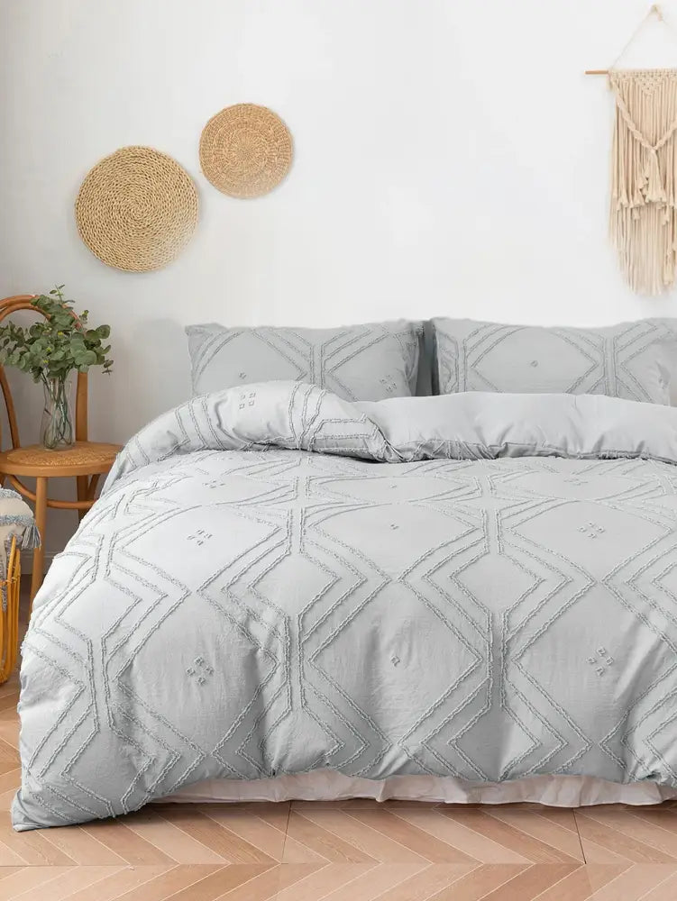 Light gray quilted microfiber duvet cover set with geometric embroidery pattern from DecorBites™ cover set