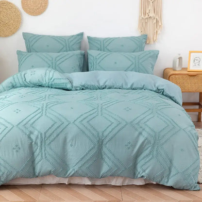 Teal-colored quilted duvet cover set with geometric embroidery pattern made of soft tufted microfiber by decorbites