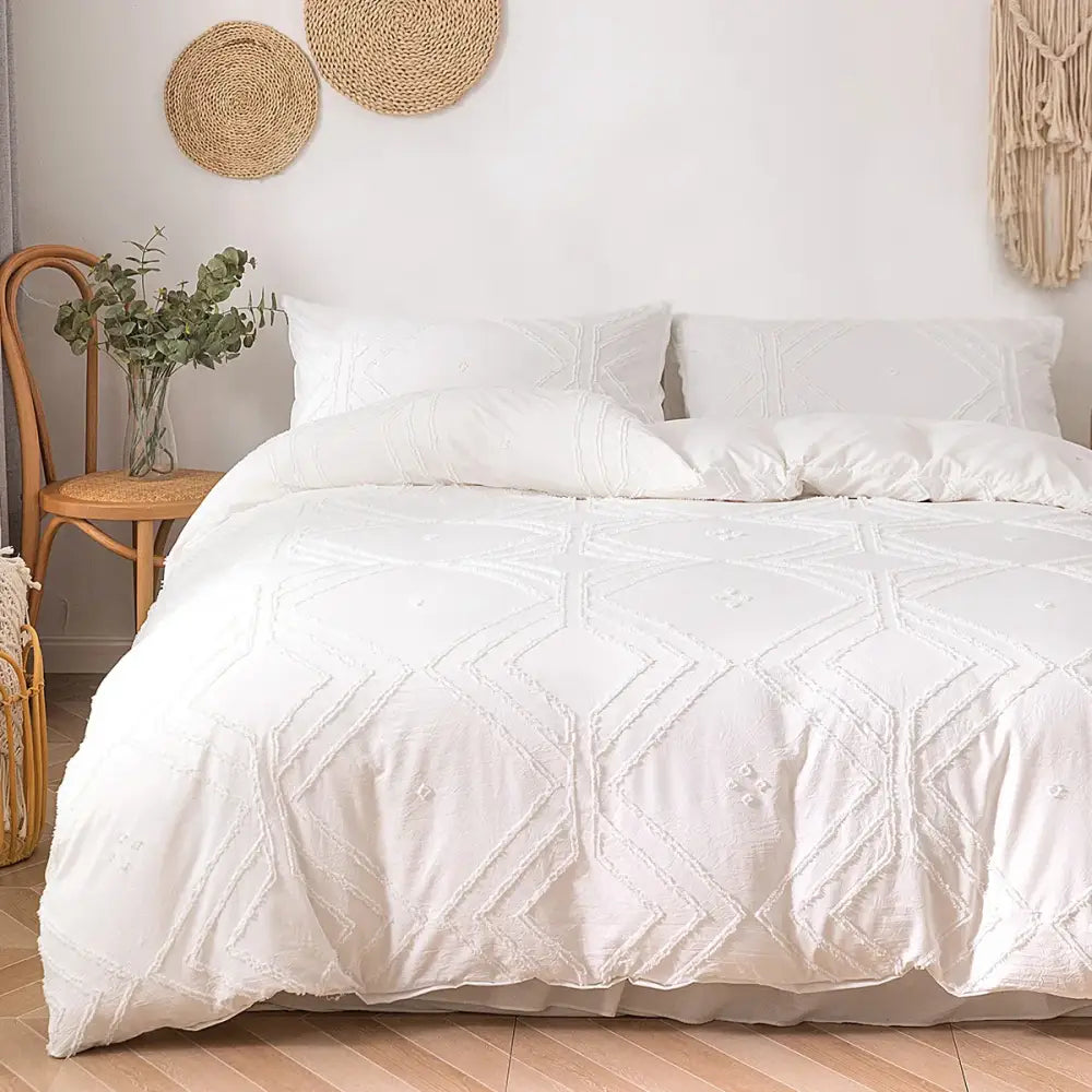 White textured duvet cover set with geometric embroidery pattern made from soft tufted microfiber by DecorBites
