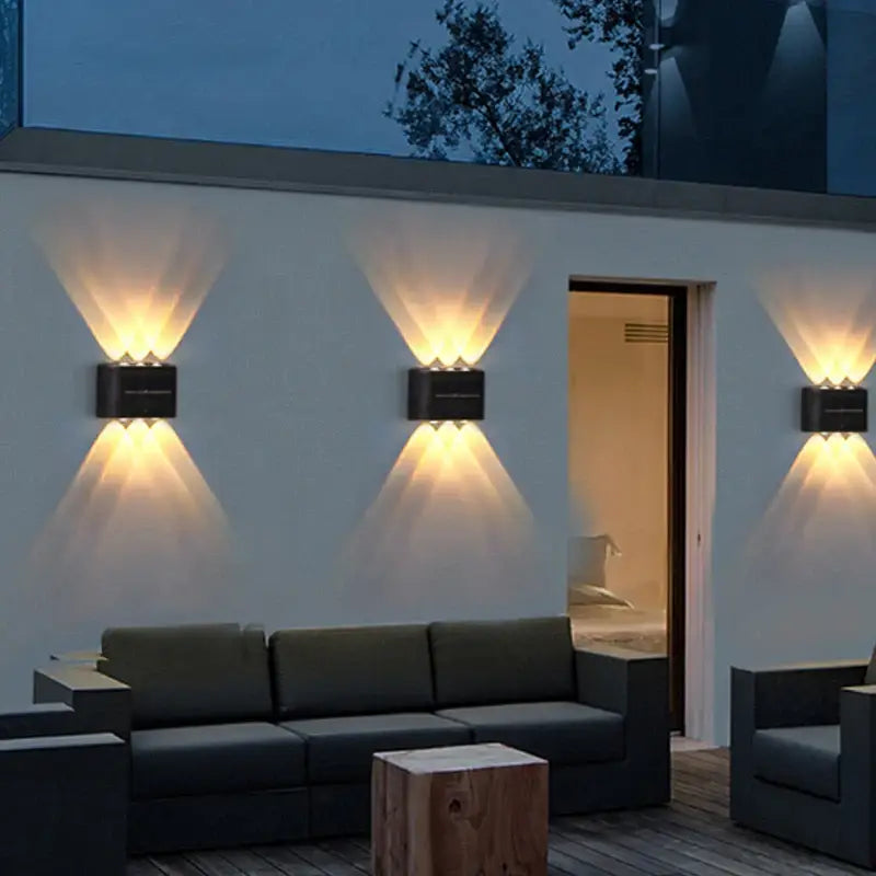 Black rectangular DecorBites™ solar led wall light with dual upward lamp beads casting warm angled beams