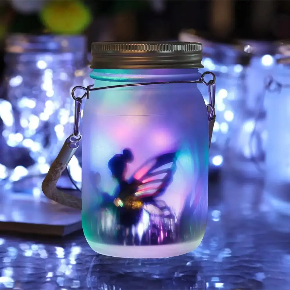 A translucent glass solar mason jar with metallic lid and colorful led lights illuminating a fairy figurine inside