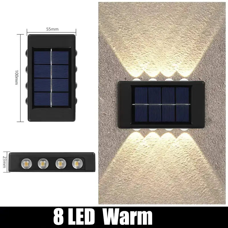 Black rectangular DecorBites™ solar outdoor wall light with eight warm white LEDs for garden decor
