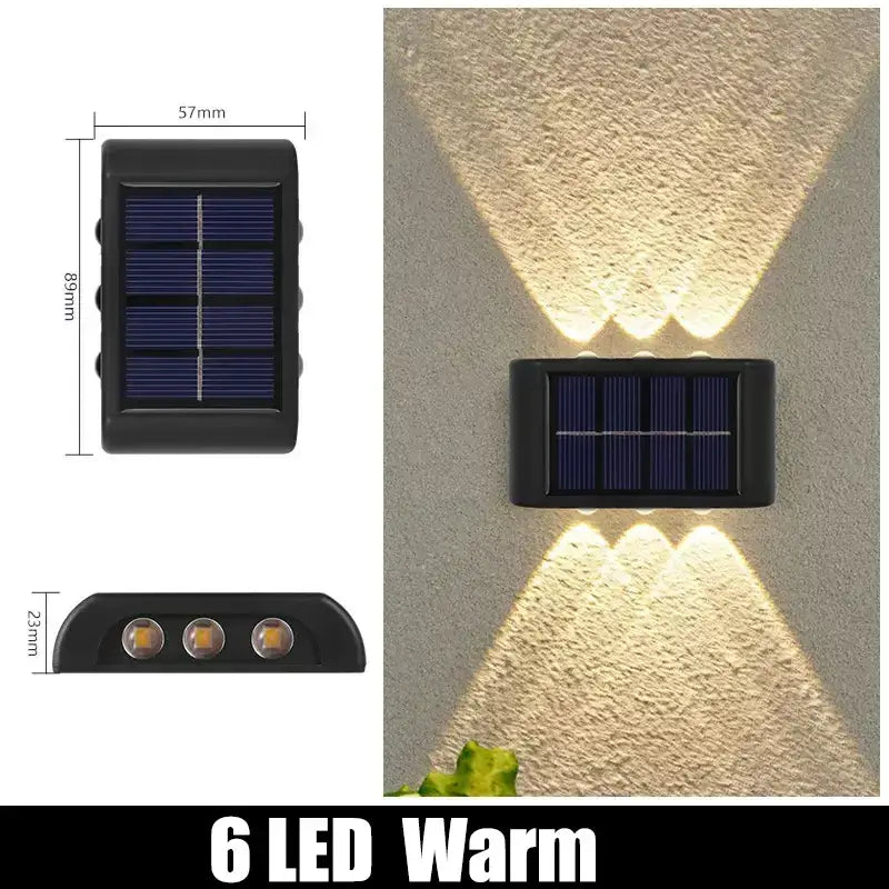 Black rectangular solar outdoor wall light with three warm white led bulbs for garden decor by DecorBites