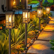 Decorbites™ solar pathway lights bronze finished with clear glass panels and warm yellow light for outdoor use