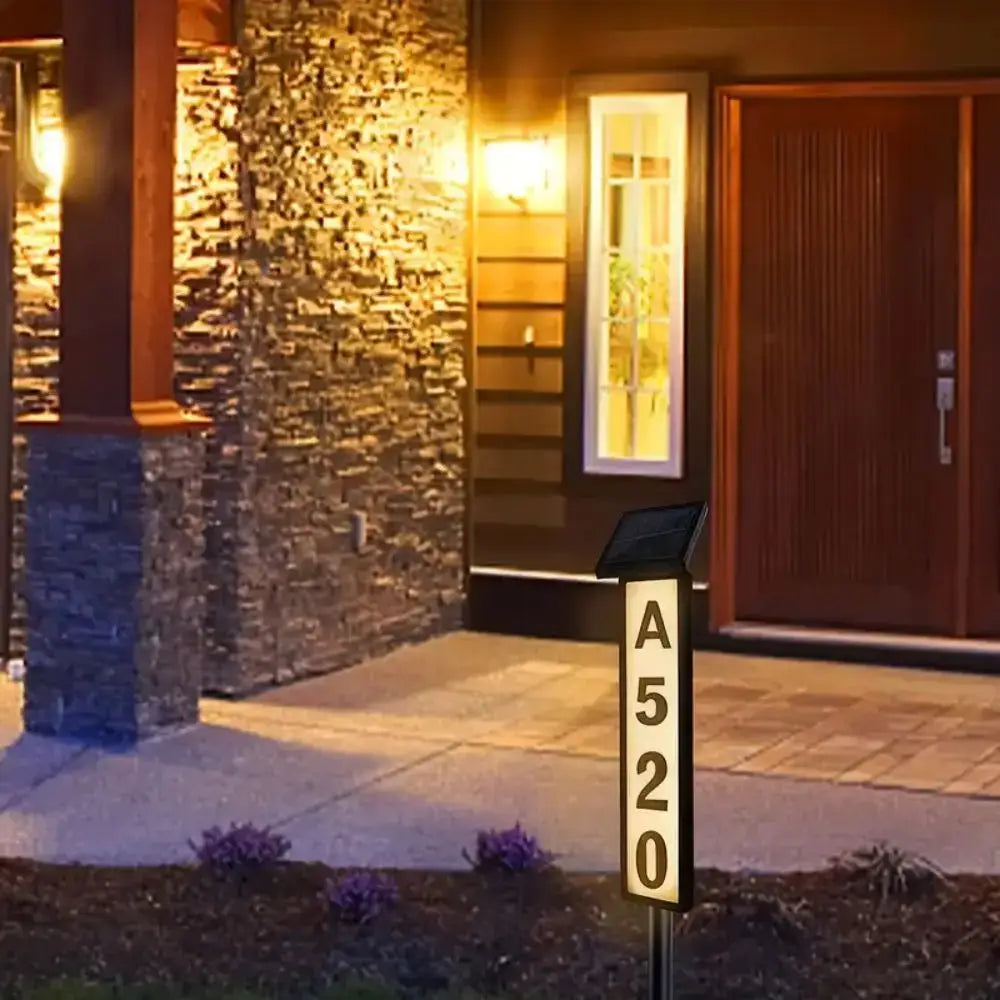 Decorbites™ sleek black solar powered led house number light displaying a520 in illuminated white numerals