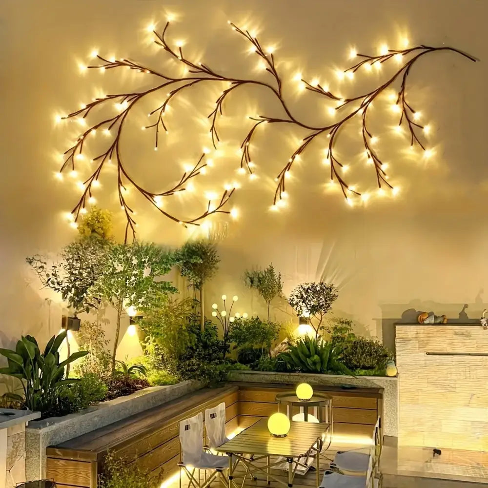Decorbites™ solar willow vine light featuring warm white led bulbs on dark brown metal branch for outdoor use