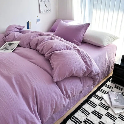 Purple quilted solid cotton bedding set with matching duvet cover and contrasting white pillow by DecorBites