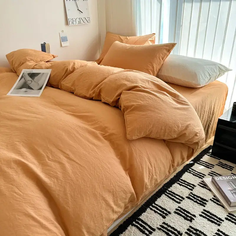 Warm orange duvet cover and matching pillows in DecorBites solid cotton bedding set with soft slightly wrinkled fabric