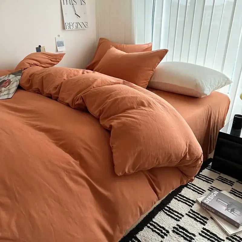 DecorBites™ solid cotton bedding set with warm terracotta duvet cover and matching pillows with white accent pillow