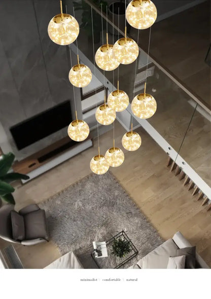 Decorbites™ spiral crystal ball chandelier light featuring golden spherical pendant lights with warm glowing interiors