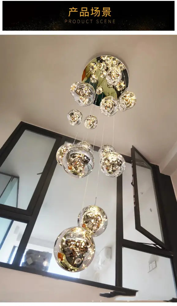 Modern chrome finished crystal ball chandelier with cascading glass orbs from decorbites spiral collection