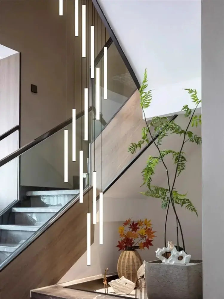 Modern white cylindrical pendant lights in a staggered arrangement for decorbites spiral led ceiling chandelier