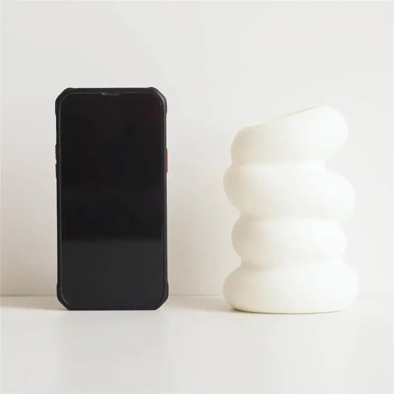 White ceramic spiral white vase with stacked rounded segments for home decor by DecorBites™