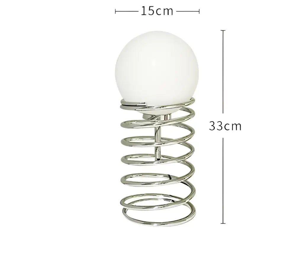 DecorBites™ spring glass table lamp with a chrome spring base and white spherical glass shade for modern decor