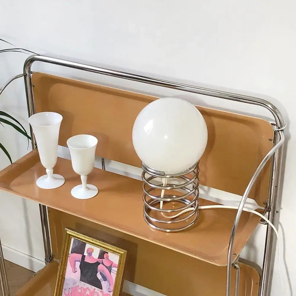 Decorbites™ spring glass table lamp with sleek chrome spiral base and smooth white spherical glass shade for modern decor
