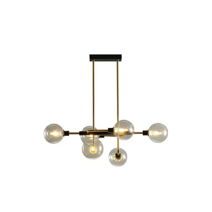 Modern brass and black sputnik hanging island light with clear glass globes for dining room decor by DecorBites™
