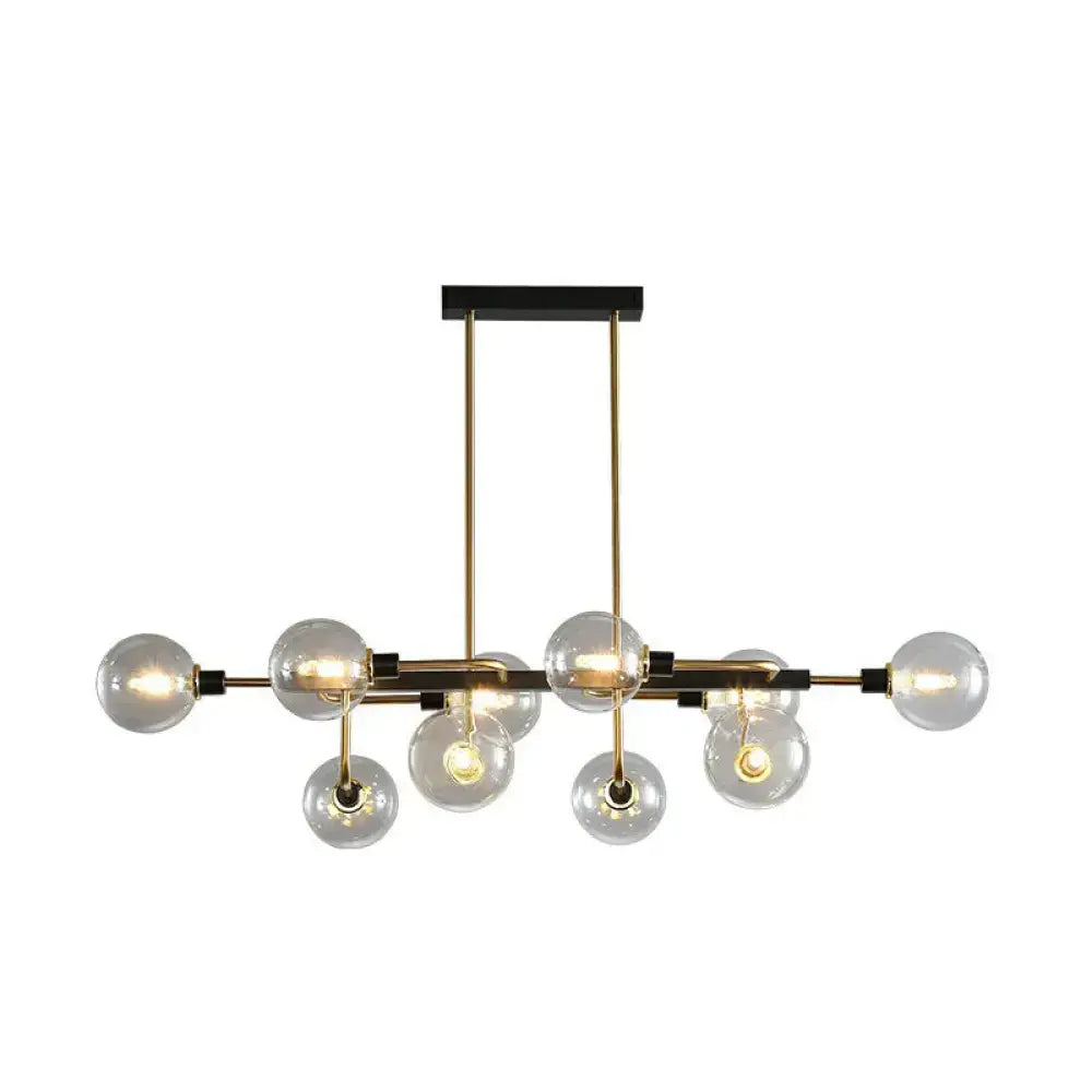 Modern brass and black sputnik hanging island light with clear glass globe bulbs for dining room decor