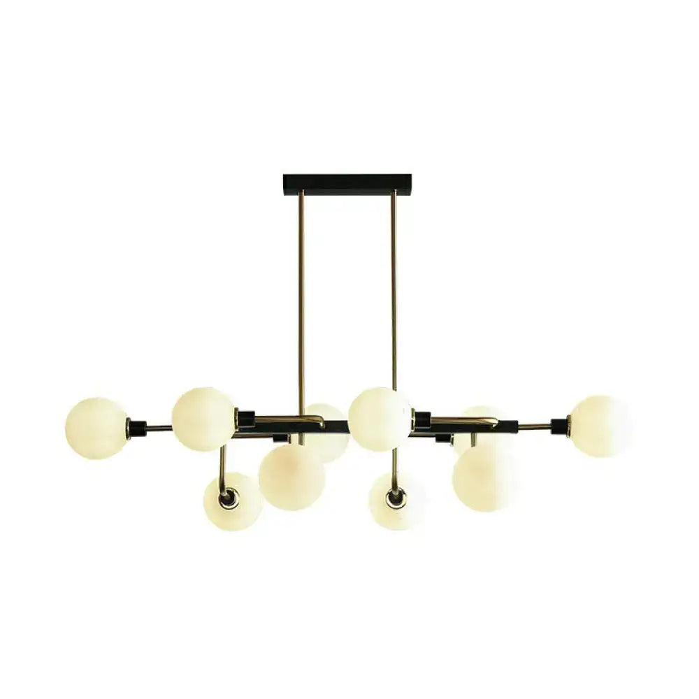 Modern black and brass sputnik hanging island light with frosted glass globe bulbs for dining room decor
