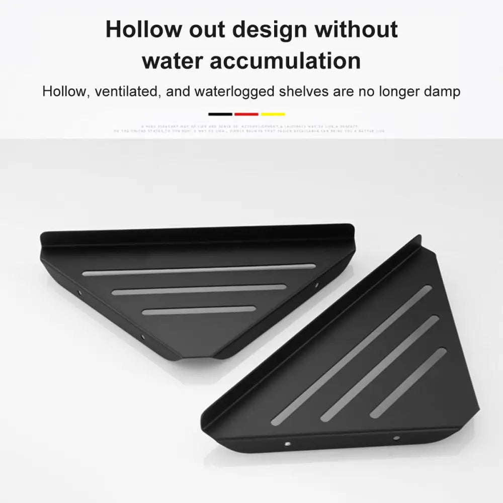 Black triangular stainless steel corner shower shelf inserts with horizontal slats for ventilation by decorbites
