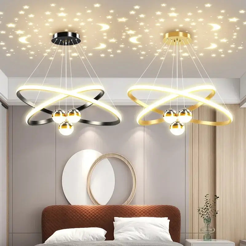 Two modern DecorBites™ starry sky led chandeliers with black and gold circular rings and warm bulbs for living room