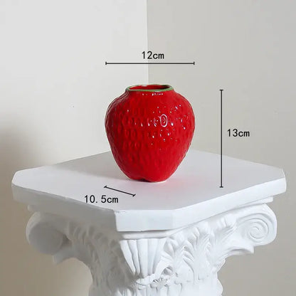 Glossy red ceramic vase shaped like a textured strawberry cartoon ceramic vase for kids room by DecorBites™