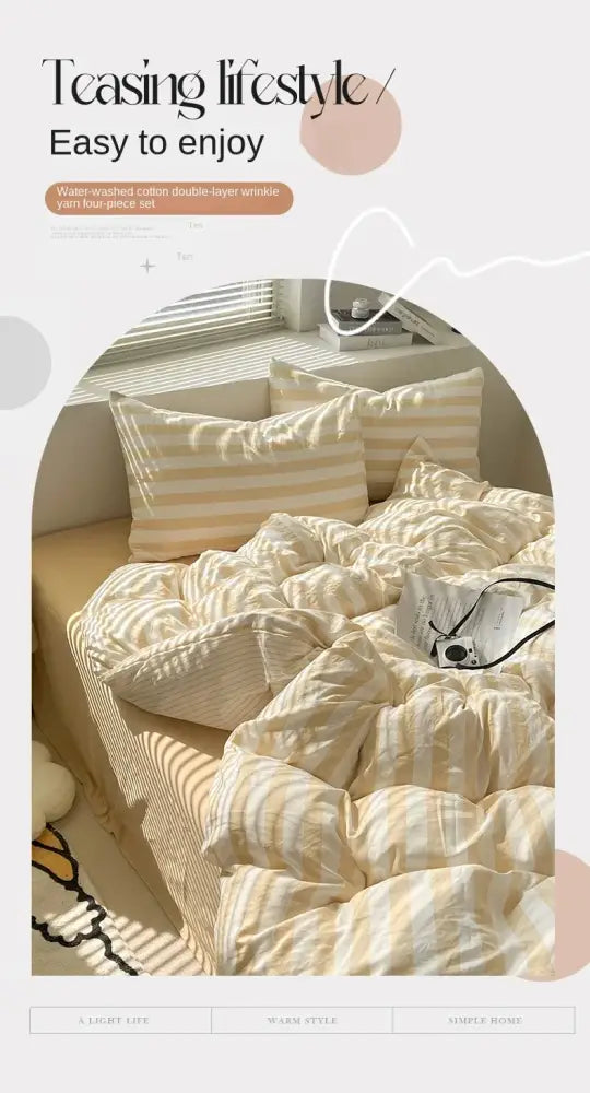 A cozy decorbites™ striped quilt set with pillowcases and bed sheet in soft cream and pale yellow cotton yarn