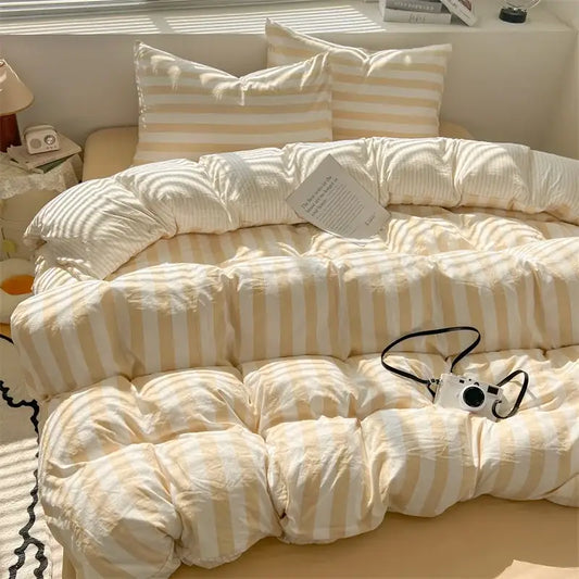 Cream and beige striped quilt set with pillowcases and bed sheet featuring a soft puffy texture by decorbites