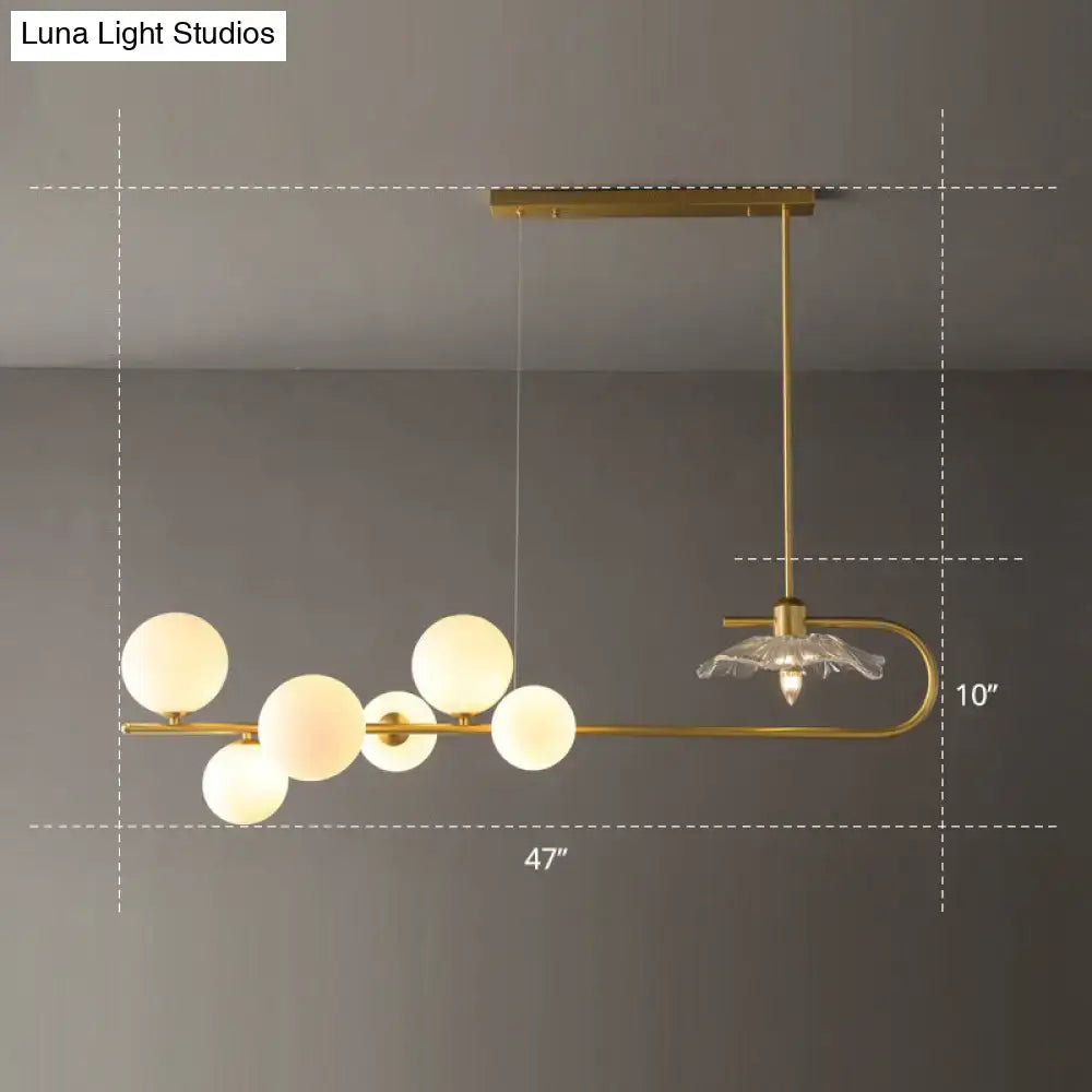 DecorBites postmodern suspension lamp with gold-toned curved arm lotus leaf design and frosted glass spheres